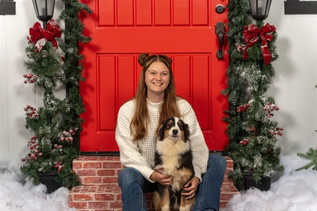 Jordan with a black tri Australian Shepherd — BFF Aussies owner and breeder